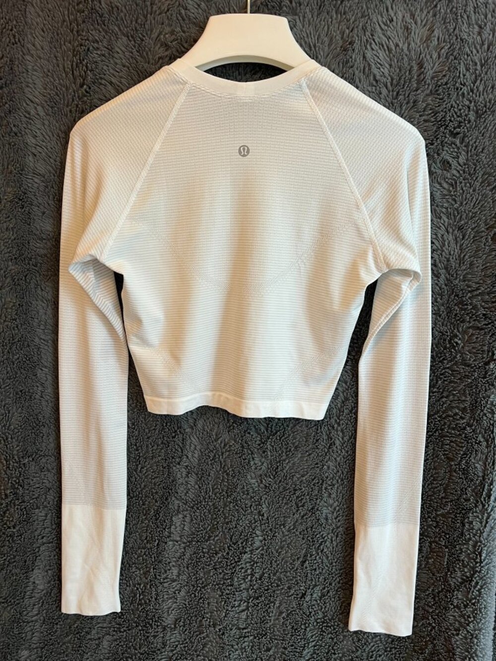 Lululemon Swiftly Tech Cropped Long-Sleeve Shirt in a soft white/ivory shade